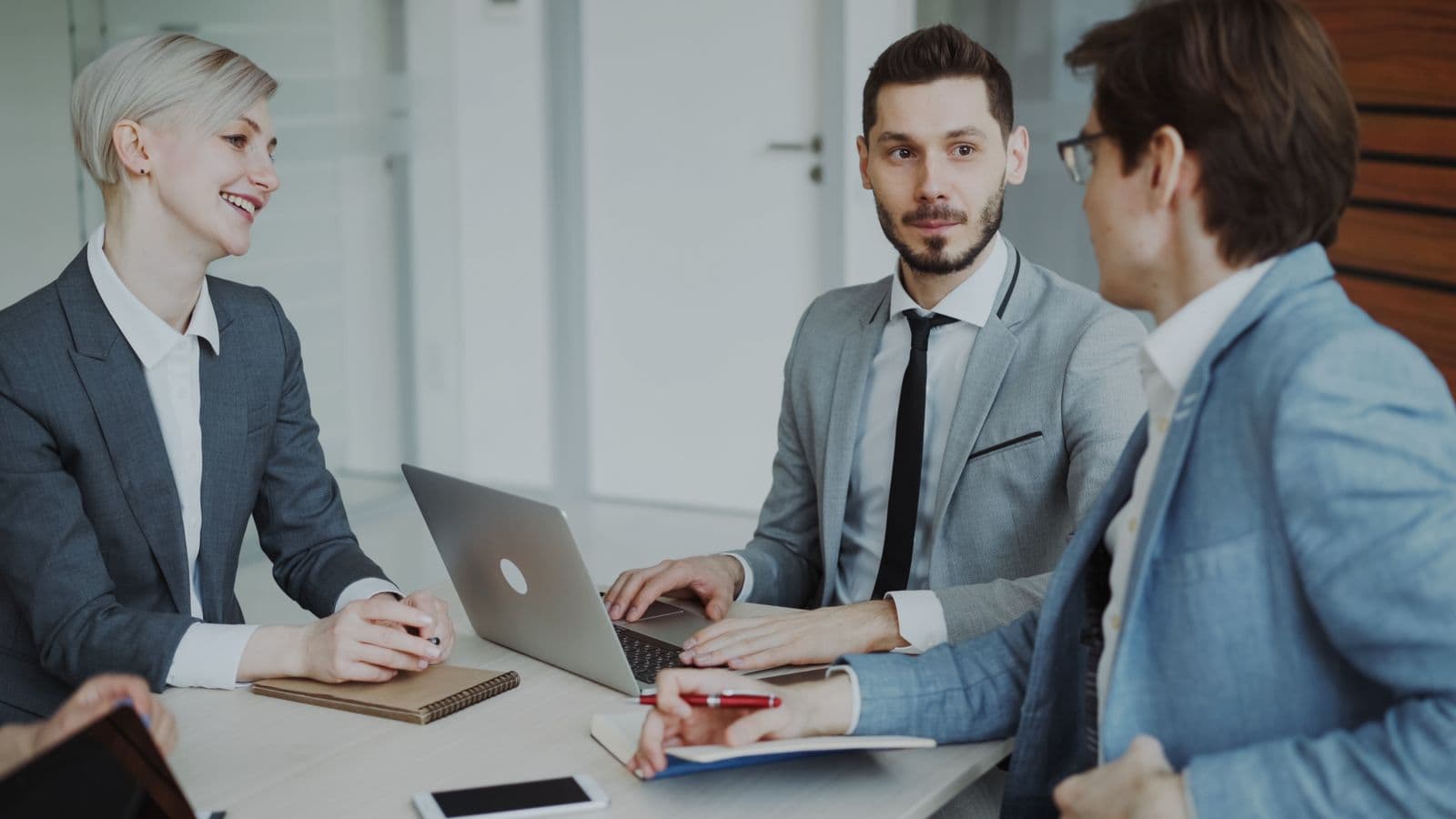 Consultants agreeing a permanent hire with a client