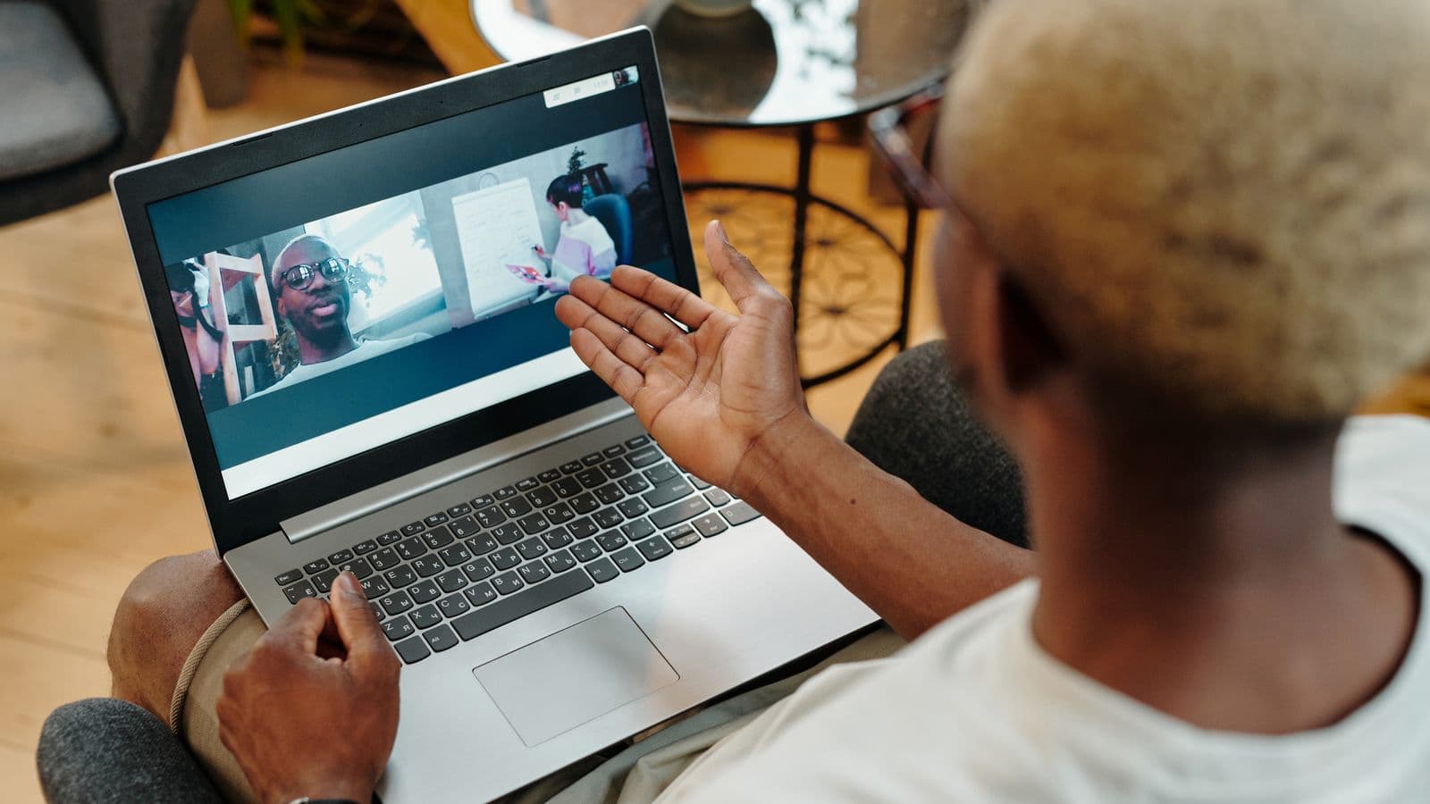 Hiring managers discussing the UK's SAP Business One talent shortage over open laptops